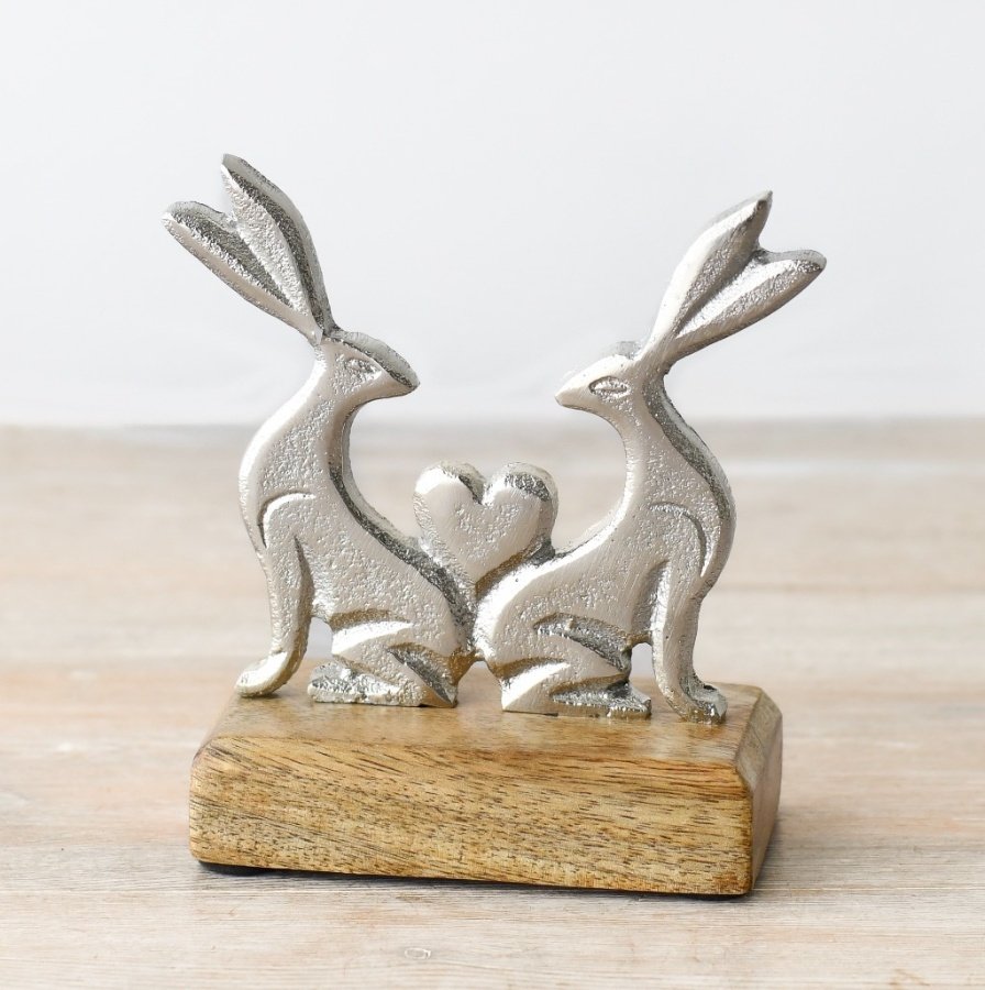 Adorn your space with a sweet rabbit figurine on a charming wooden base.