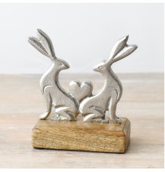 Adorable rabbit figurine on wood base - a delightful addition to any decor.