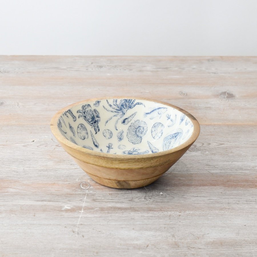 Enhance your space with a stunning wooden bowl featuring a vibrant enamel coastal interior.