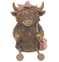 Introduce a touch of rustic elegance to the home with this delightful highland cow figurine.