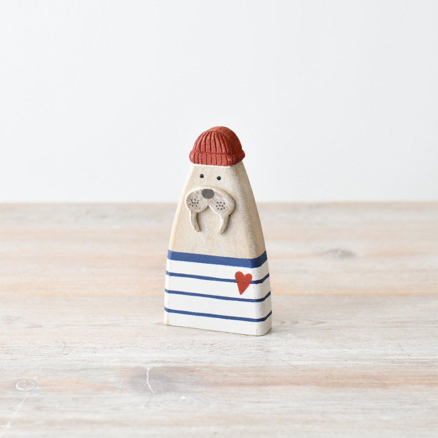 Add some coastal charm to your decor with our handcrafted Sea Lion figurine, 