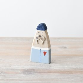 Bring a touch of seaside whimsy to your décor with this charming sea lion figurine 