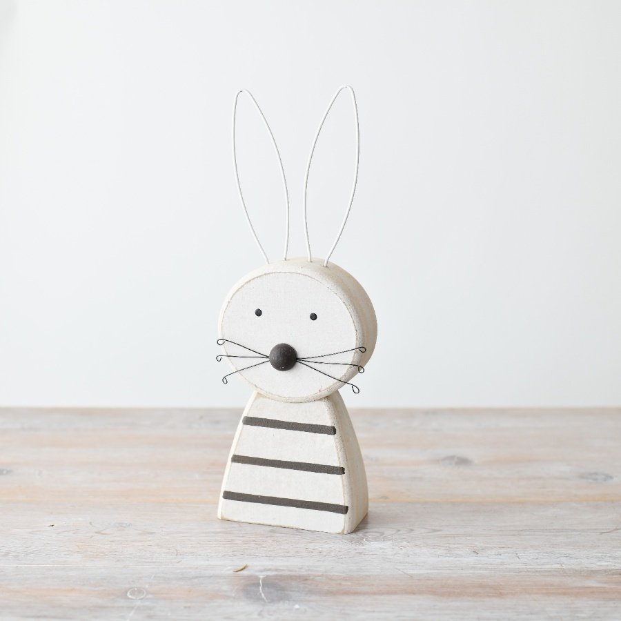 Enticing wood rabbit decoration, crafted to add rustic appeal to your space.