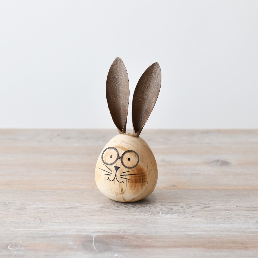 Bring rustic charm into your space with our handmade wooden rabbit figurine.