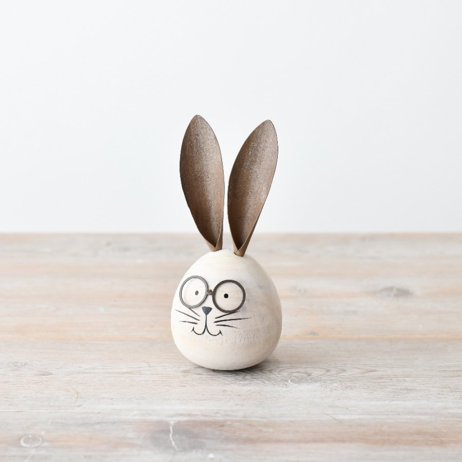 Adorable round wooden bunny rabbit with charming features.