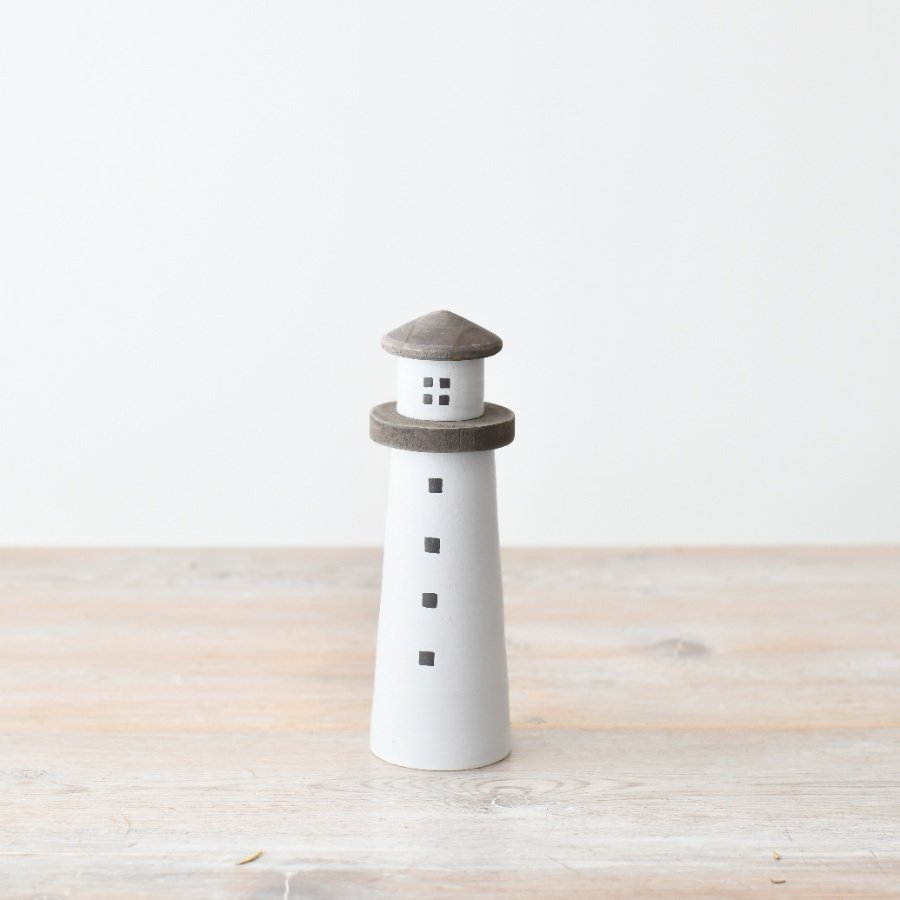 Add a touch of charm to your home with our wooden light house decoration.