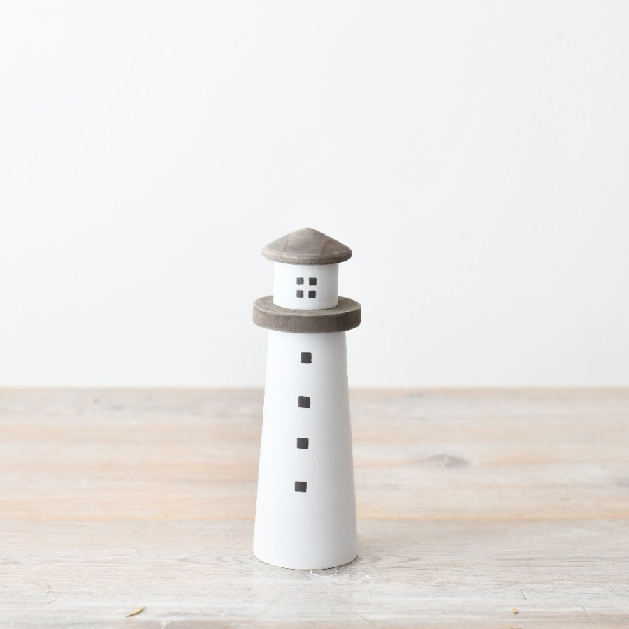 Charming lighthouse decoration for a touch of seaside charm. 