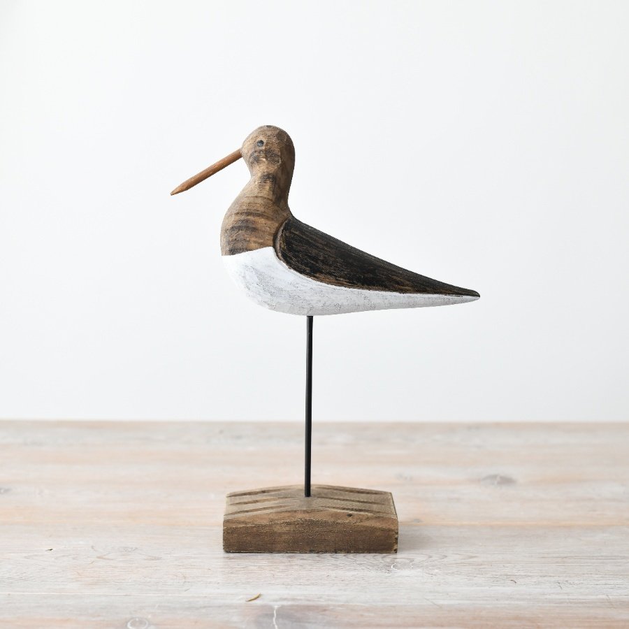 Add charm to any space with our delightful wooden bird on a stick, adorned with a wooden base.