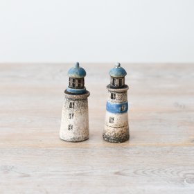 Add a unique touch to your home with this charming lighthouse decoration, perfect for adding a touch of coastal ambian