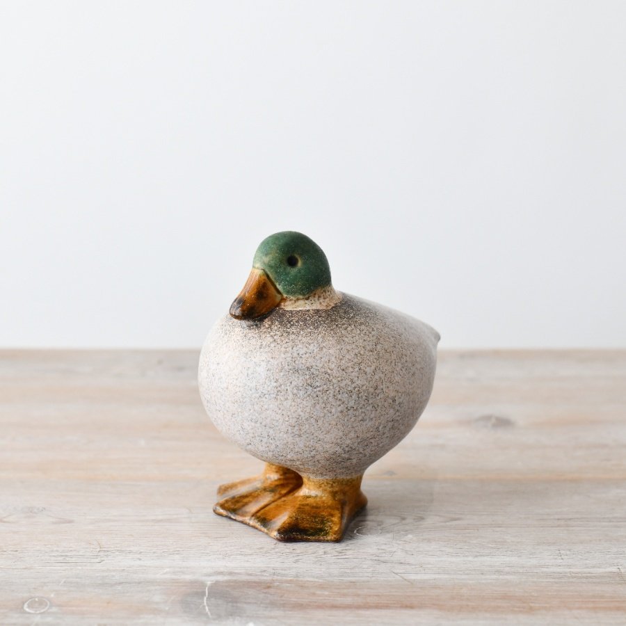 A delightful duck figurine to bring whimsical charm to any room