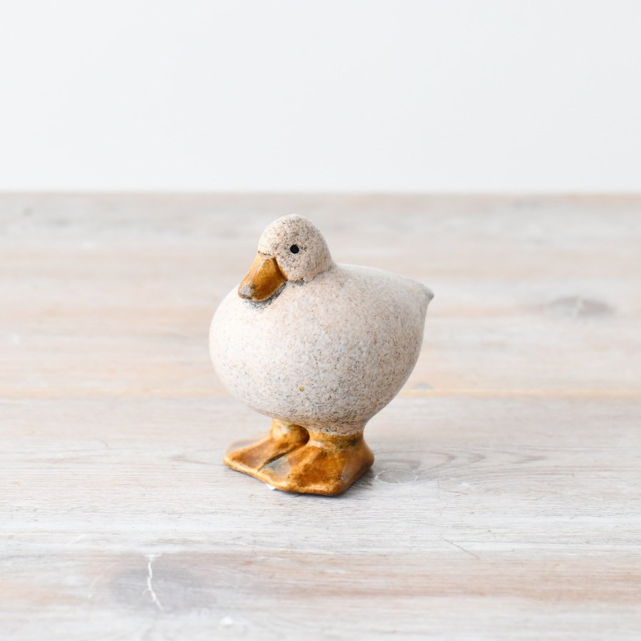 Delightful duck decoy with speckle design adds charm to any outdoor display.