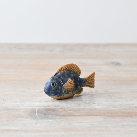A cute fish ornament with a blue and orange speckle finish 
