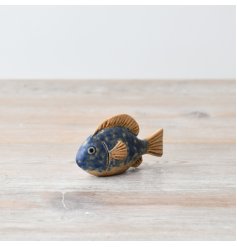 A cute fish ornament with a blue and orange speckle finish 