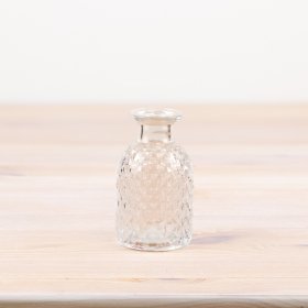 Decorate your space with a charming patterned vase, perfect for adding an artistic touch to any room.