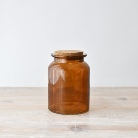 A beautiful jar with lid, perfect for storing dried materials.