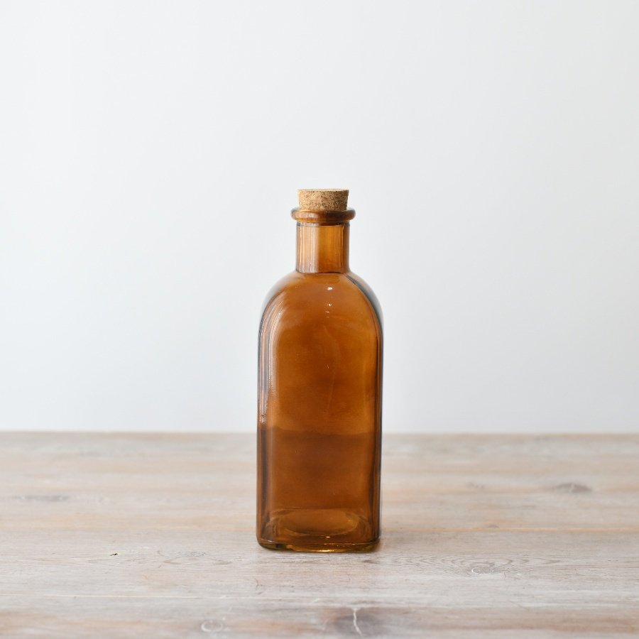 Enhance your space with charm and character using our elegant Glass Bottle With Cork and Painting design.