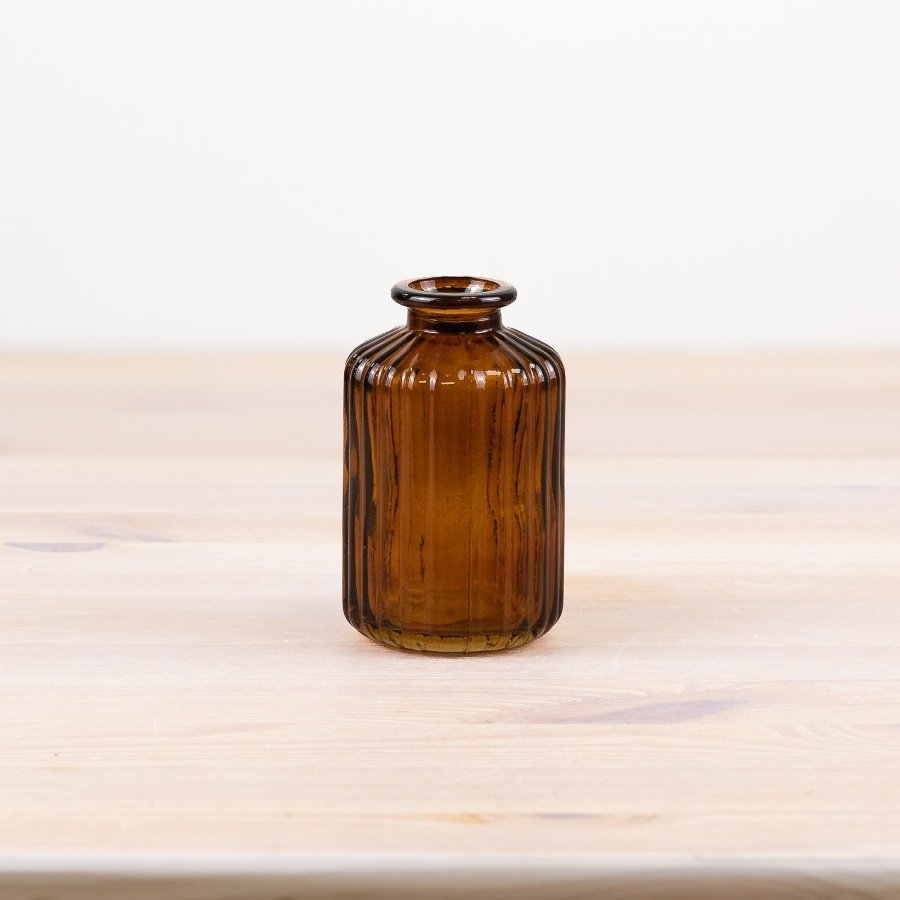 Bring sophistication to your home decor with our stylish brown bottle vase, perfect for any room