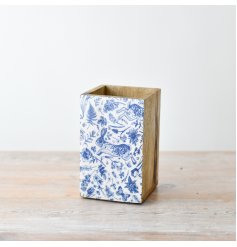 A charming wooden box adorned with a blue and white spring/ floral print.