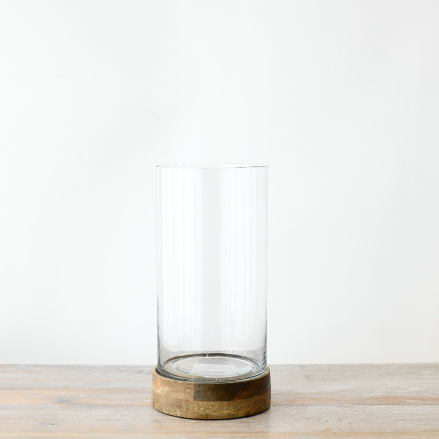 Illuminate your living space with our durable wooden and glass candle holder, boasting an elegant design.