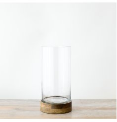 Illuminate your space with our chic candle holder, made from premium wood and glass. 