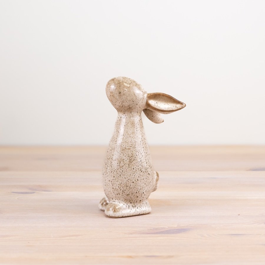 Embrace the charm of our Bunny stoneware figurine. Perfect for any bunny lover's collection.