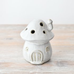 Brighten up your indoors with enchanting charm from this illuminated mushroom house