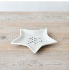 Adorable dish perfect for holding small objects like jewelry and coins. Features a charming star design.