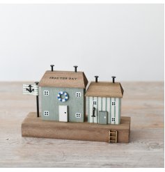 Unwind in a beachfront paradise with "Seas The Days" wooden house - a must-have for any lover of the coast!