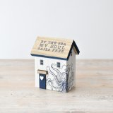 An ocean-inspired oasis awaits with our 'by The Sea My Soul Sails Free' Wooden House – the perfect coastal retreat 