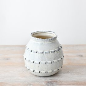 Elegant and rustic flower vase complements any decor.