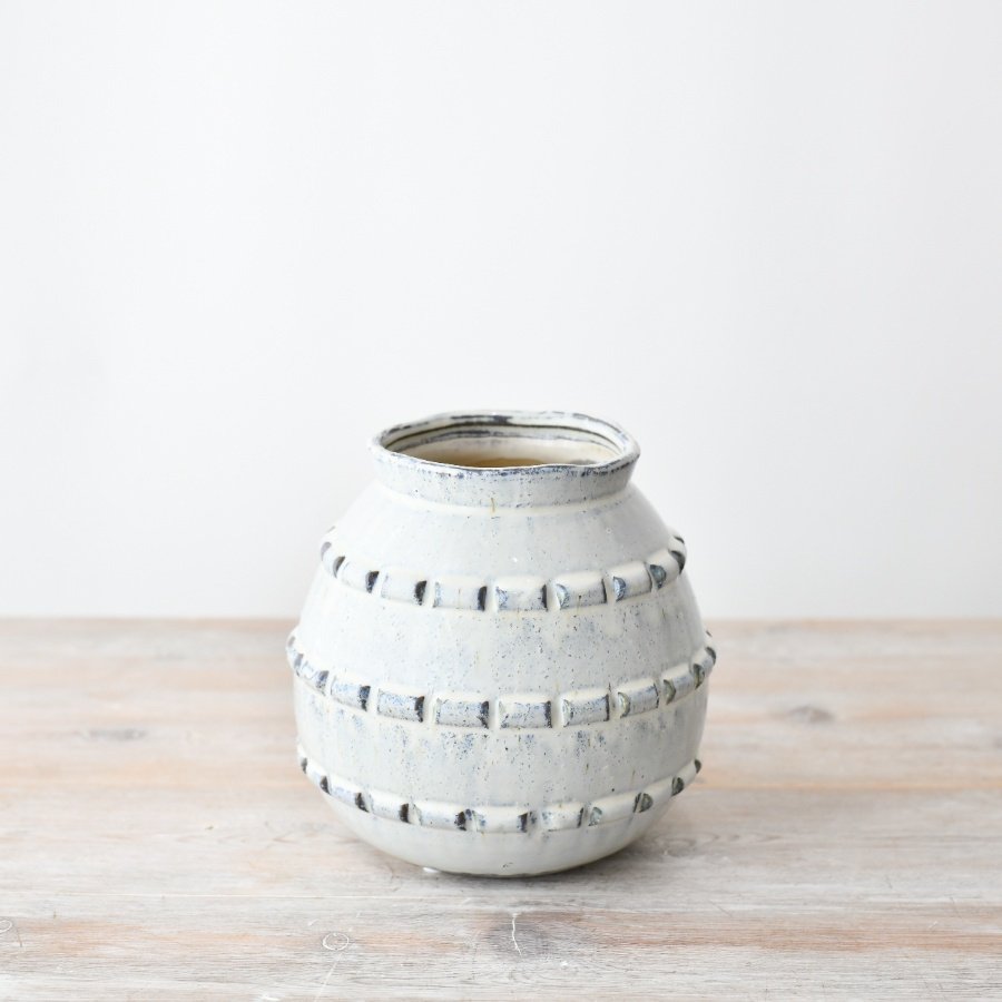 Add a touch of elegance to any decor with this chic grey planter, perfect for displaying both real and artificial flow