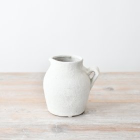 Enhance your kitchenware with a touch of natural charm in this adorable jug. Perfect for serving and styling