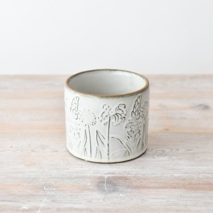 Add a touch of natural beauty to your home with our stunning flower-designed pot in an earthy hue.