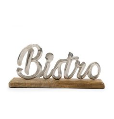 a cute metal Brito ornament pleased on a wooden mount