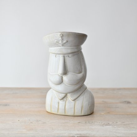 "Bring the beauty of the sea into your home with our charming Captain Ornament,