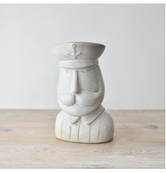 "Bring the beauty of the sea into your home with our charming Captain Ornament,