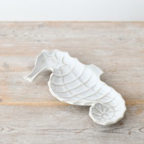Enhance the decor with a stunningly neutral seahorse dish, perfect for a coastal vibe.