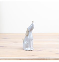 This gorgeous porcelain dog ornament featured with a dainty black bow is perfect for all dog lovers! 