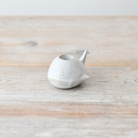 Create a serene coastal vibe with our elegant whale-shaped candle holder.