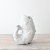 A large fish vase in a sleek white colour with a clear glaze.