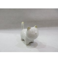 "Adorable cat ornament with glazed finish."