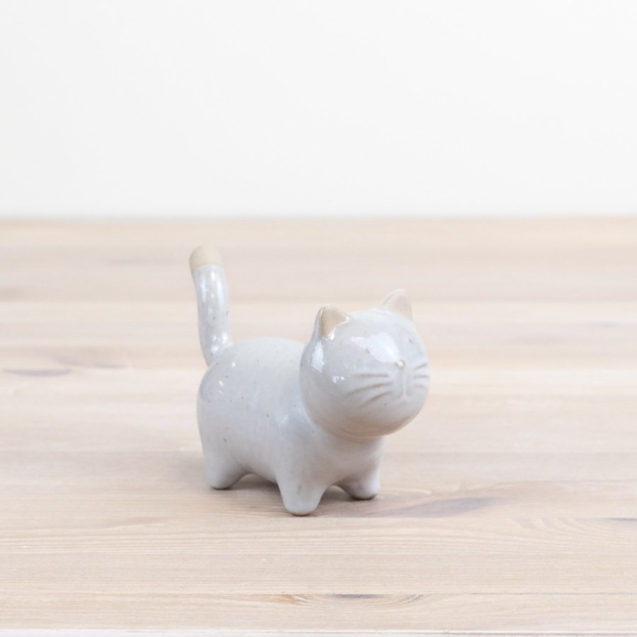 "Charming and glazed feline decor for cat lovers." 