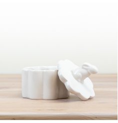 A gorgeous sleek trinket pot with a rabbit topped lid in a glazed white. 