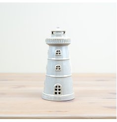 Illuminate your home with our charming Lighthouse Ornament! 