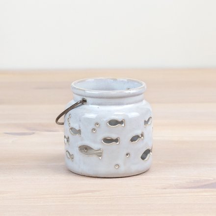 Add a touch of elegance to your home decor with our beautiful fish cut-out candle cup. 