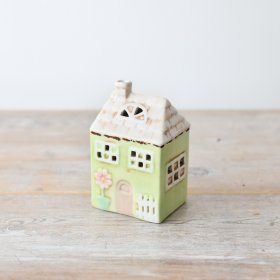 Spruce up your space with this adorable house, perfect for adding a touch of spring to your decor.