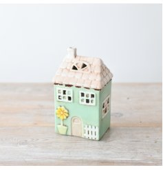 Add a touch of warmth and elegance to your home decor with our stunning LED house,