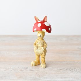Bring fun to your decor with our Rabbit Wearing Mushroom Hat figurine. Perfect for adding a quirky touch to any room.