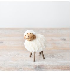 Add rustic charm to your home with this adorable woollen sheep. It's a delightful addition to any room.