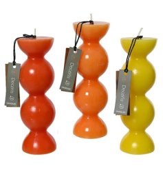 A brightly coloured chunky candle in 3 assorted designs. 